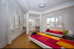 large room with twin beds park guell residence